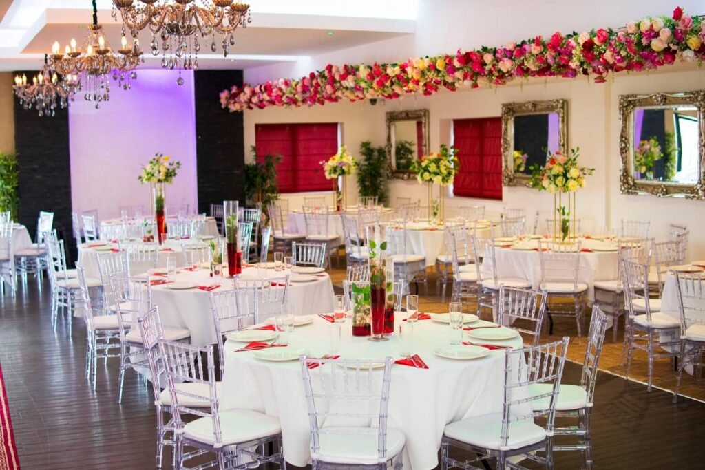 Corporate seating area at The Maison Bradford with floral panels, soft lighting and flexible layout for meetings, training days and business events.