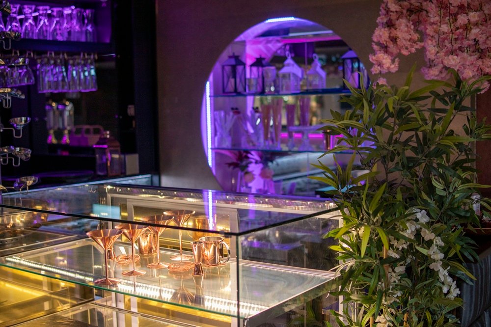 Display counter and décor inside The Maison Bradford, showing bar accessories and styling viewed during an in-person venue visit.