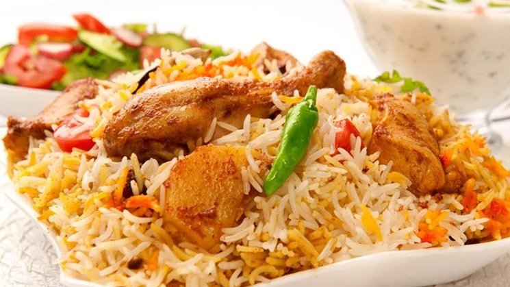 Plate of chicken biryani showing traditional Asian wedding catering served at The Maison Bradford