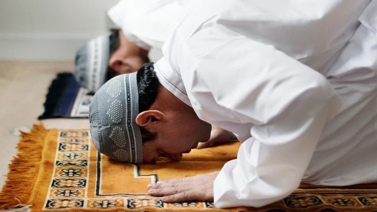Two people praying inside the dedicated prayer room at The Maison Bradford wedding venue
